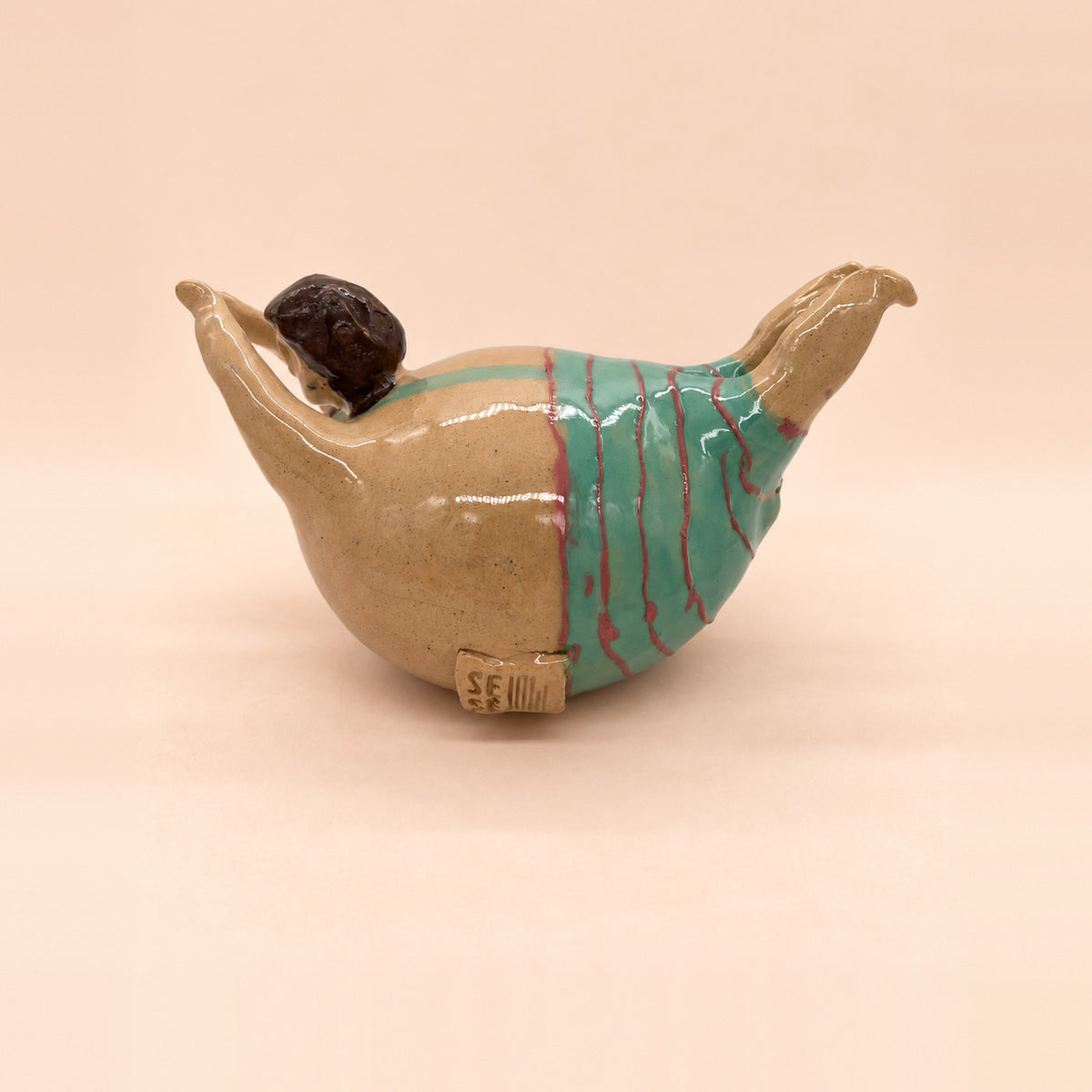 Bañista de rayas turquesa, de la pareja